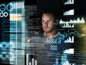 Shot of a focussed computer programmer working at his computer late at night