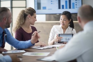 IT Auditor presenting findings to colleagues